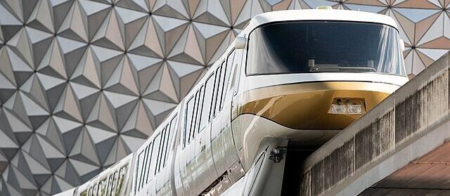 Monorail passing in front of Spaceship Earth at Epcot Center Disney World