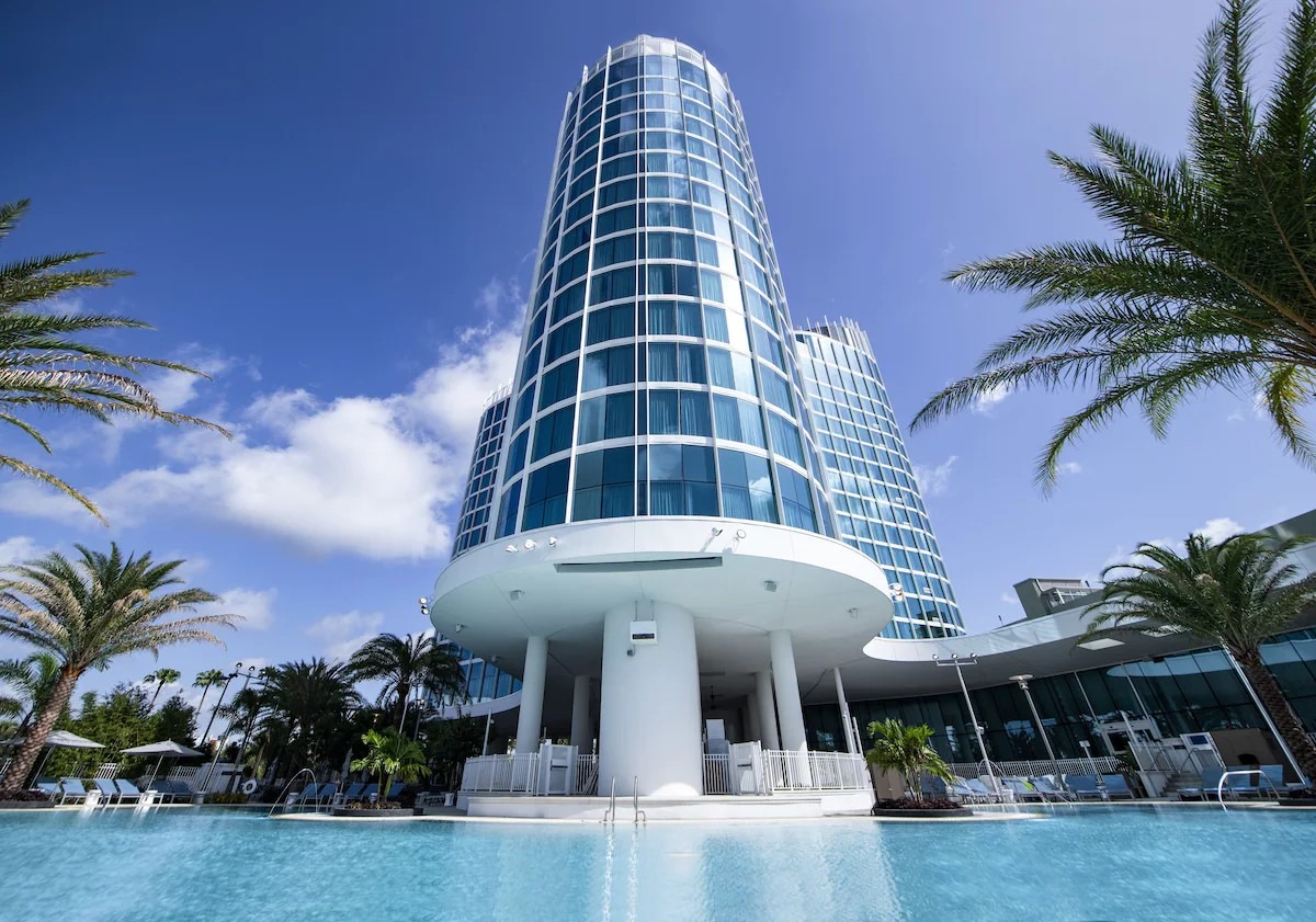 Architectural elegance of Universal's Aventura Hotel exterior with poolside views under the Florida sun, a favorite among Universal Studio Hotels in Orlando Florida