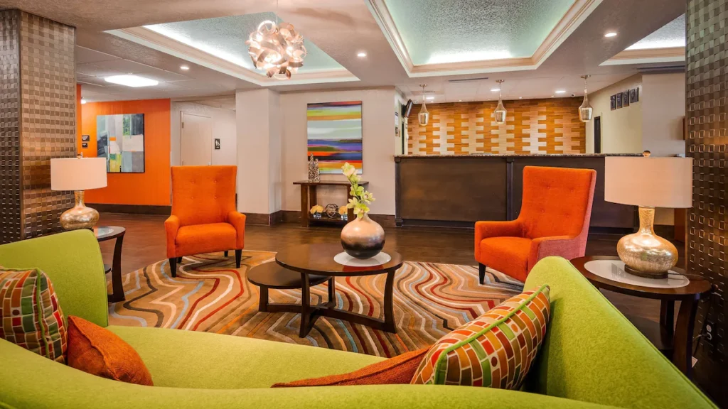 Colorful and inviting lobby of Best Western Plus Universal Orlando, featuring modern decor and vibrant seating areas.