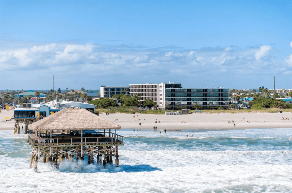 Cocoa Beach pier with Cocoa Beachfront Hotel in the background.