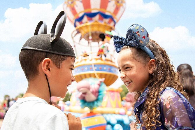 Children with Mickey Mouse ears and Minnie Mouse ears headbands after buying Disney world ticket to one of the best Florida theme parks.