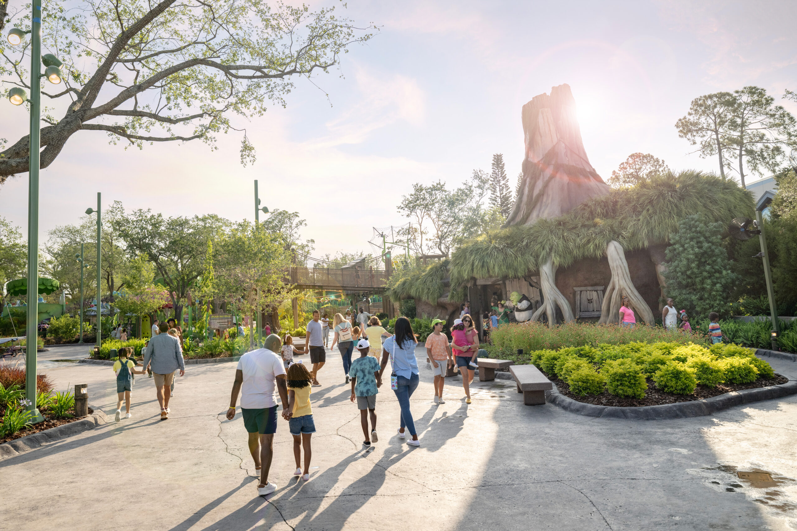 a group of people walking in a park at Universal Studios 