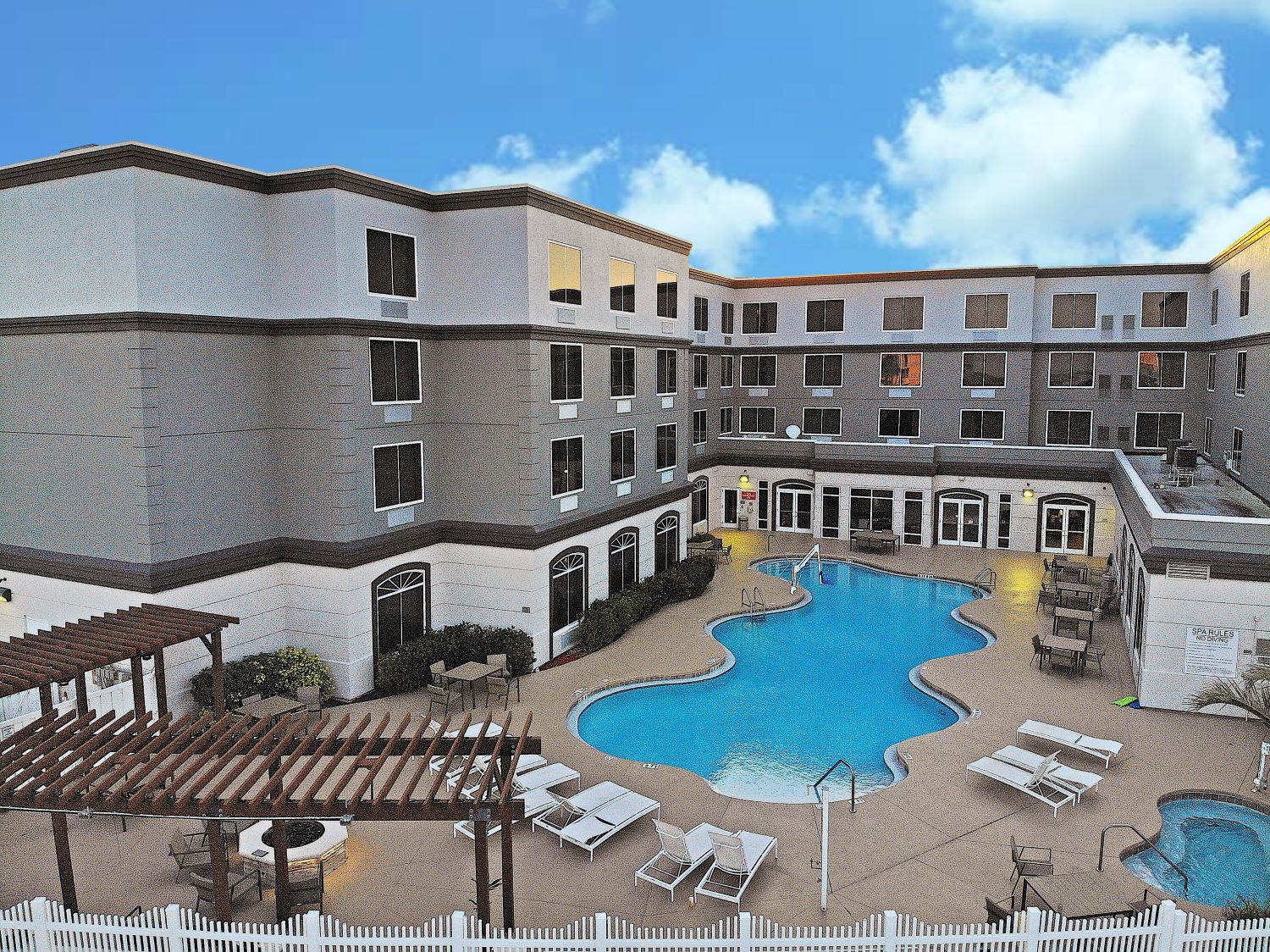 Image of the country inn and suites pool in Cape Canaveral Florida