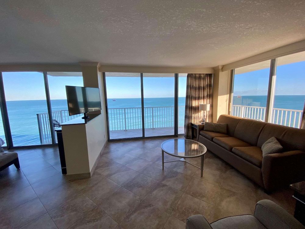 Living area of a suite at Radisson Suite Hotel Oceanfront featuring ocean views.