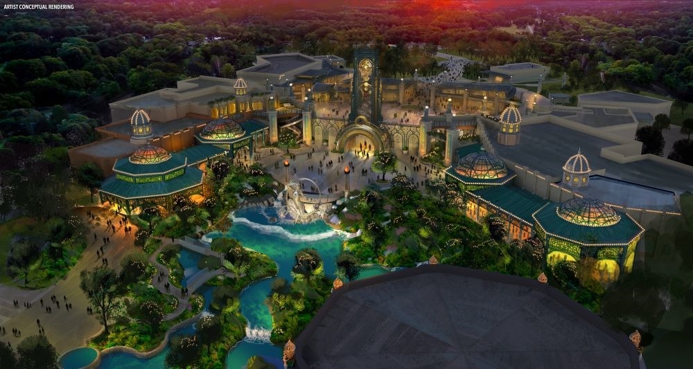 Alternate aerial concept art of Celestial Park at Epic Universe, showing lush landscaping, Constellation Carousel, Stardust Racers, and central portal locations